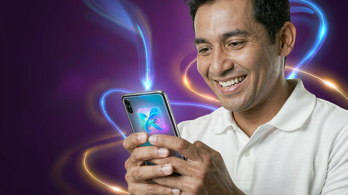 FG777 mobile guide — adult using a smartphone with a colourful display